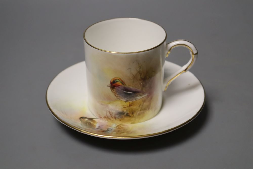 A Royal Worcester coffee can and saucer painted with game birds by P. Platts, signed, date code 1955, 12cm